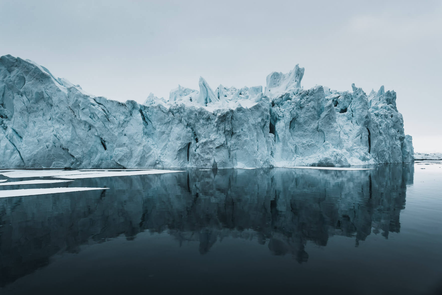 Iceberg in silent waters of Greenland