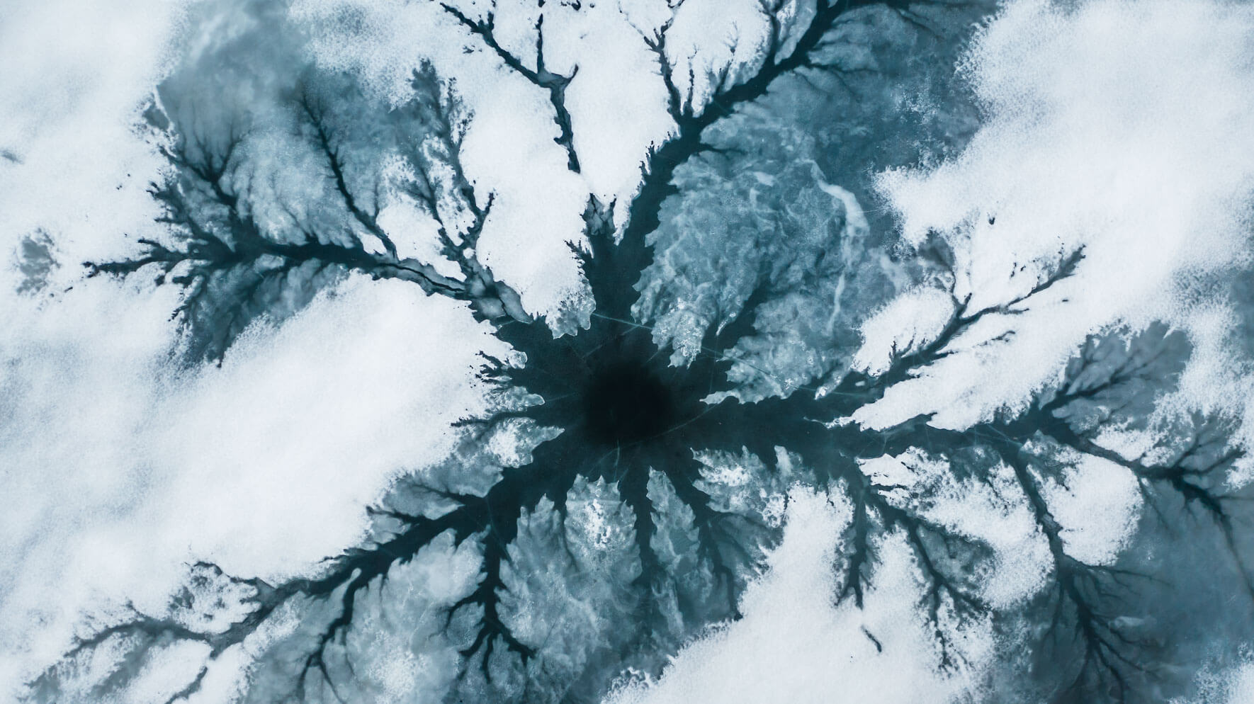 Abstract aerial photography of a frozen lake in Norway by Northlandscapes