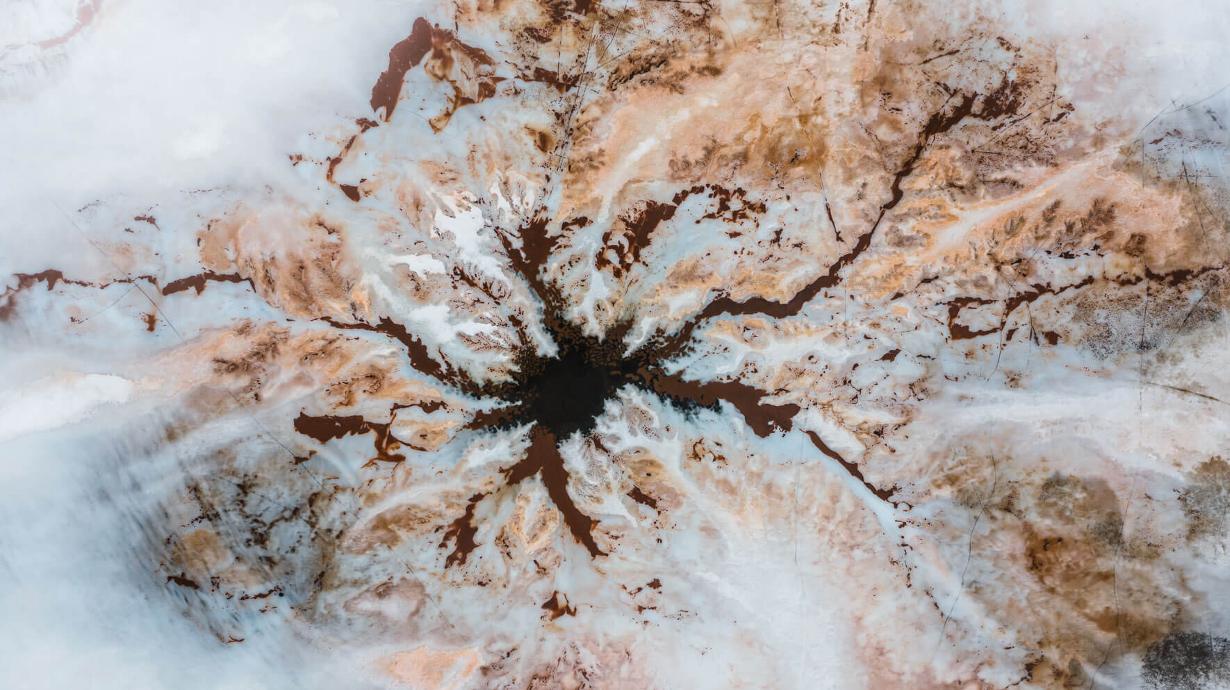 Abstract patterns on a frozen lake in Norway from a drone's perspective