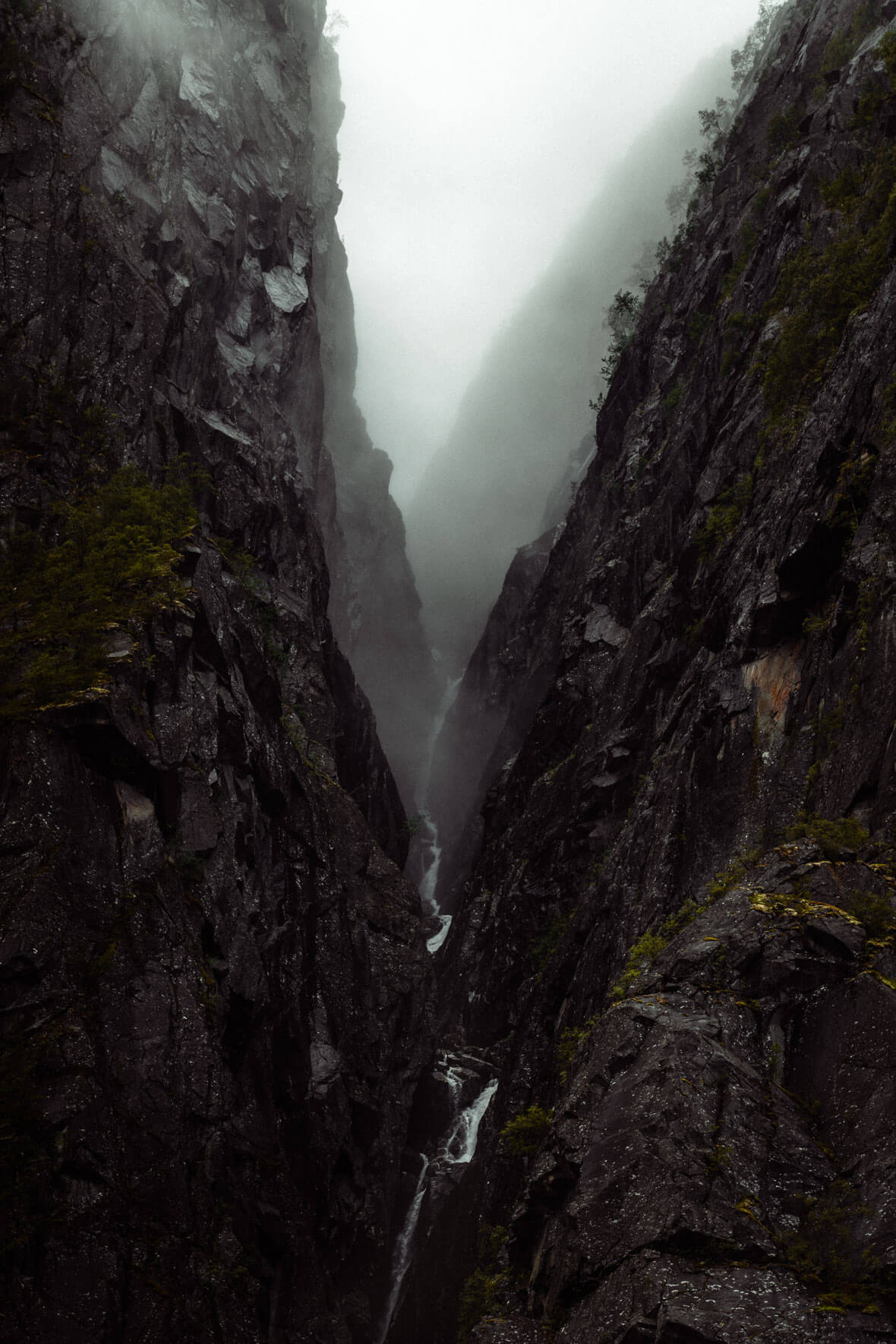Dark Canyon with Waterfall in Norway