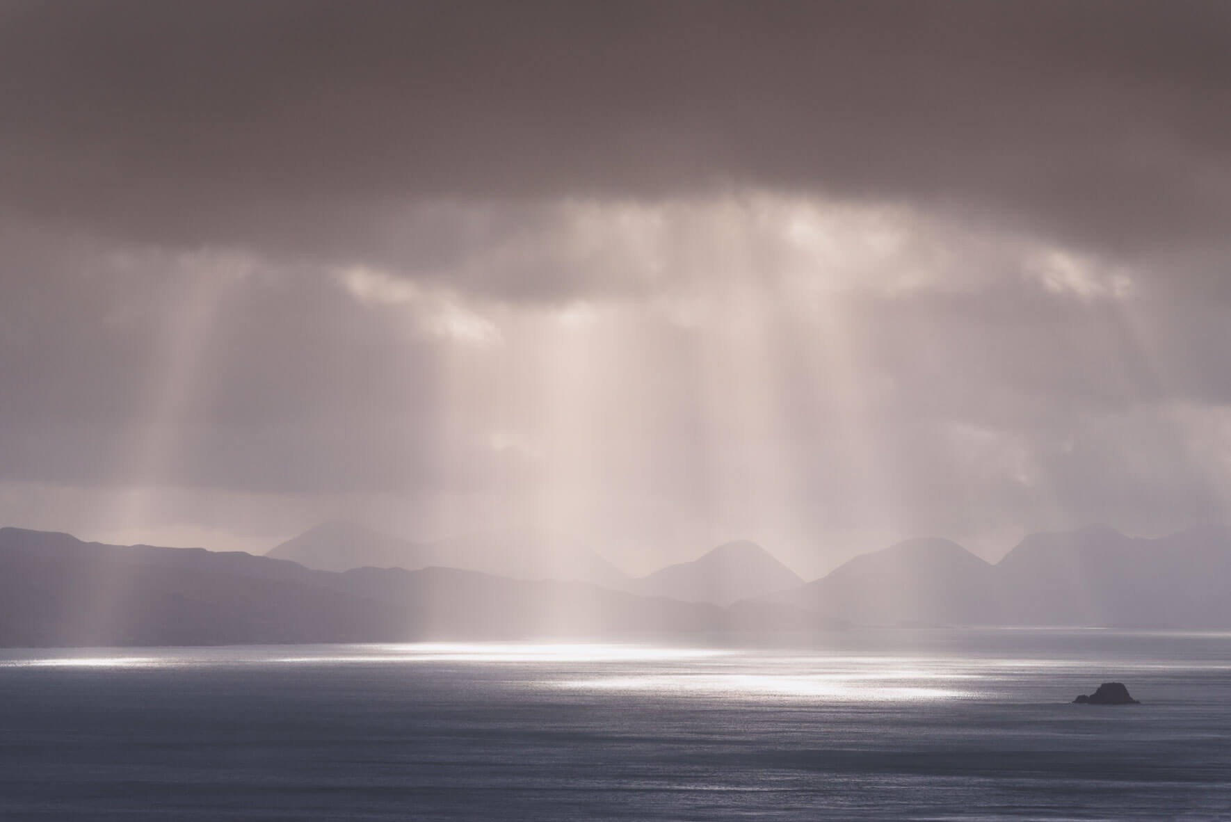 Sun breaks through the clouds over the Isle of Skye, Scotland