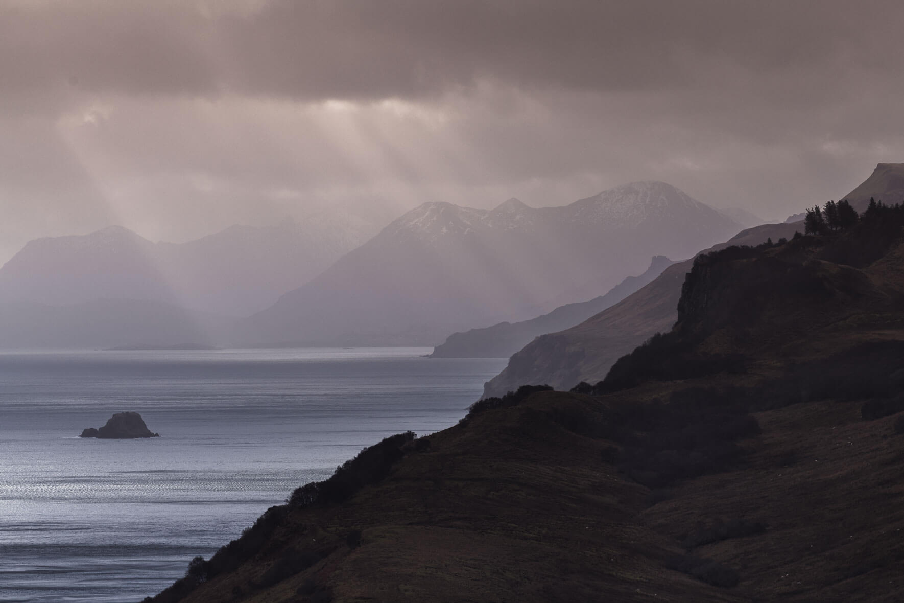 Sun breaks through the clouds over the Isle of Skye, Scotland