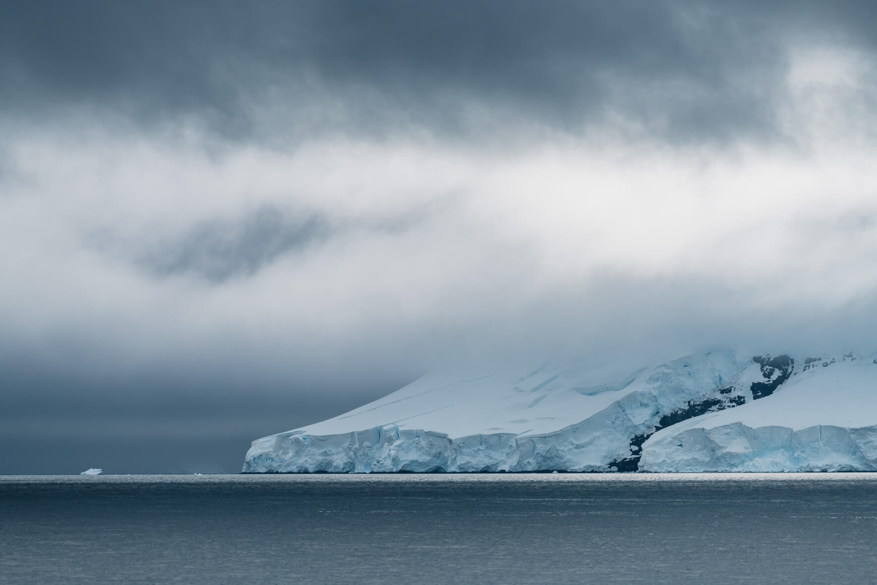 Dark clouds over glaciers in Antarctica