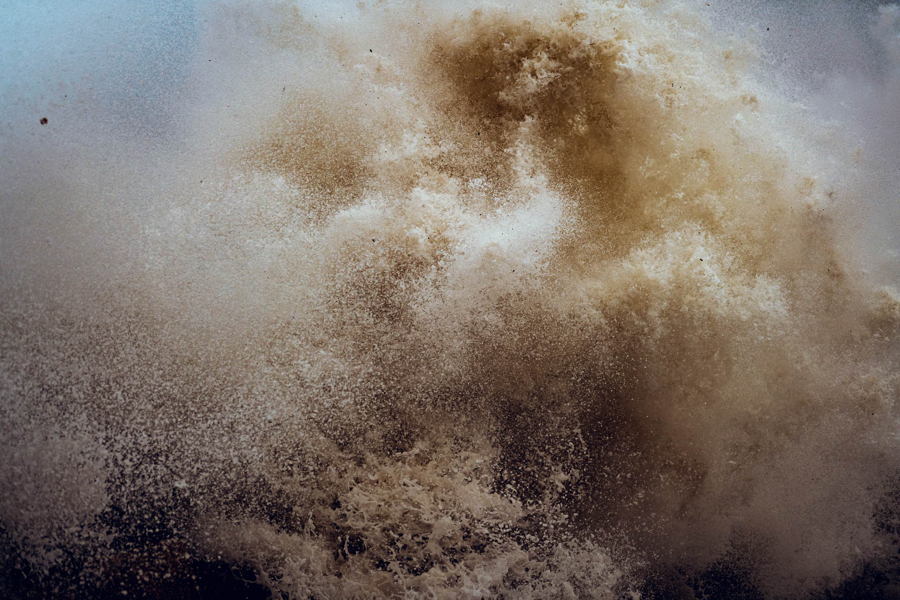 Waves breaking and crashing into the rocky seashore of the Baltic sea