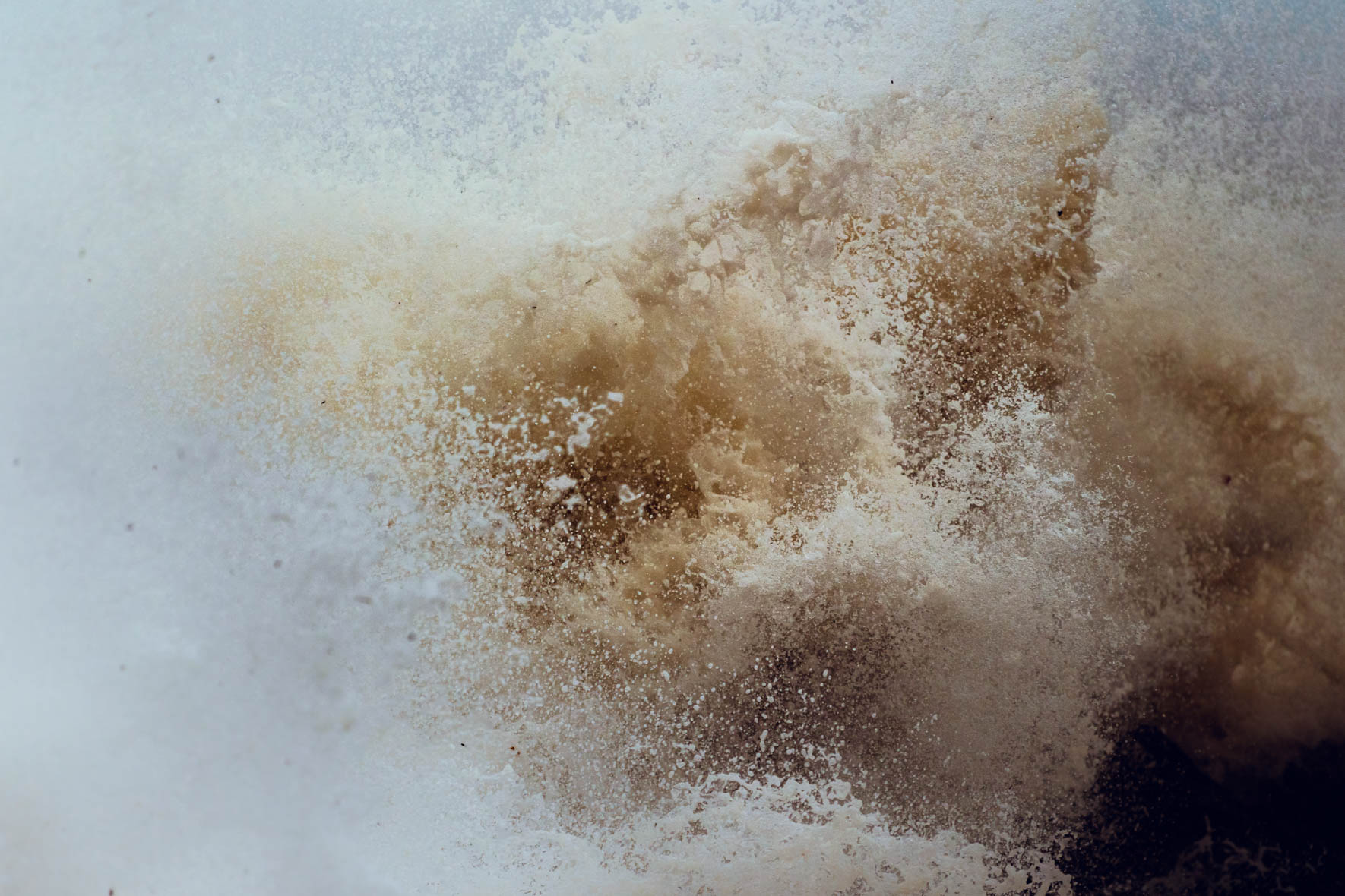 Waves breaking and crashing into the rocky seashore of the Baltic sea
