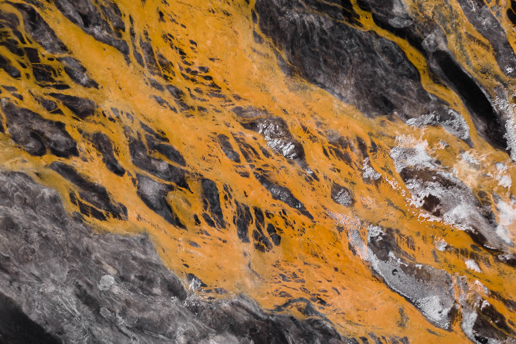 Aerial Winter Landscape of Iceland with Black Sand and Orange River