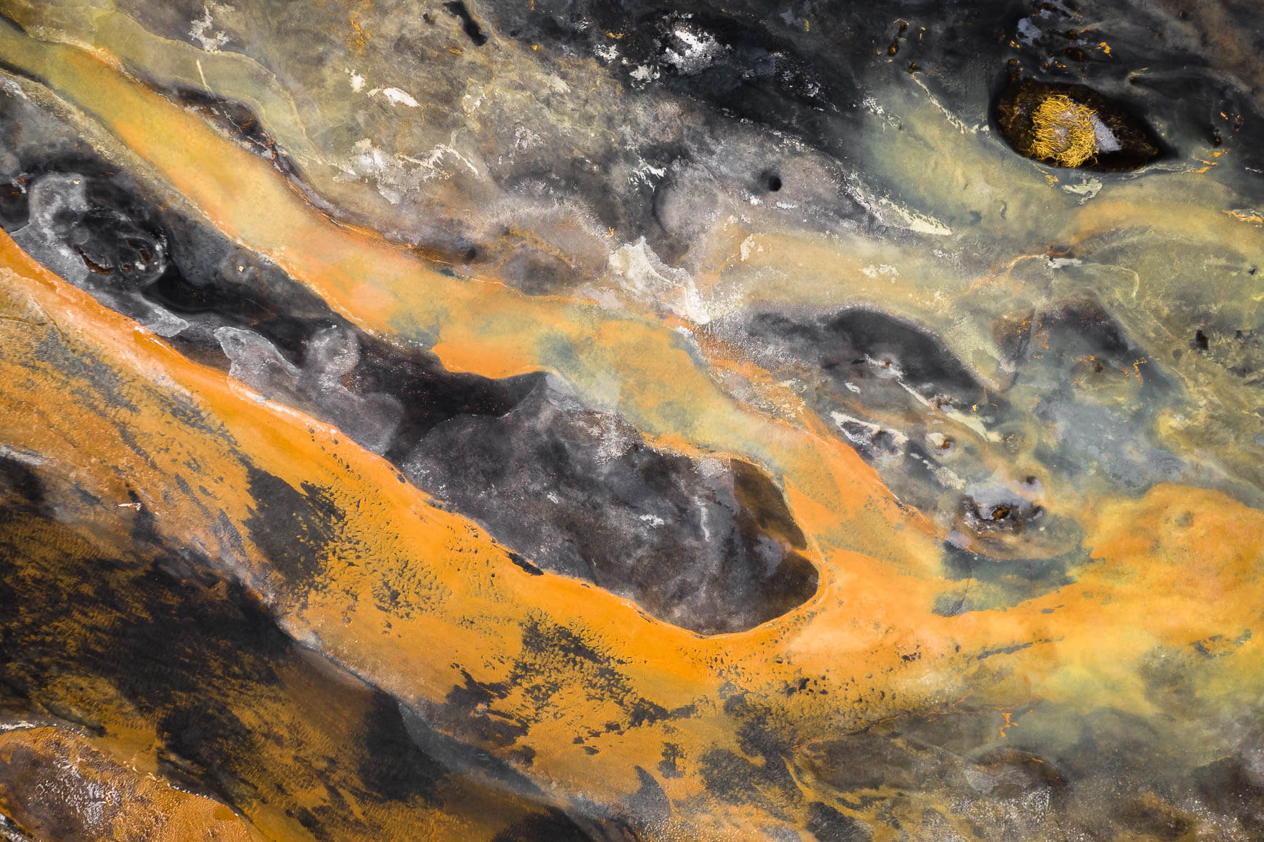 Surreal Aerial Landscape of Iceland with Orange River and Black Sand