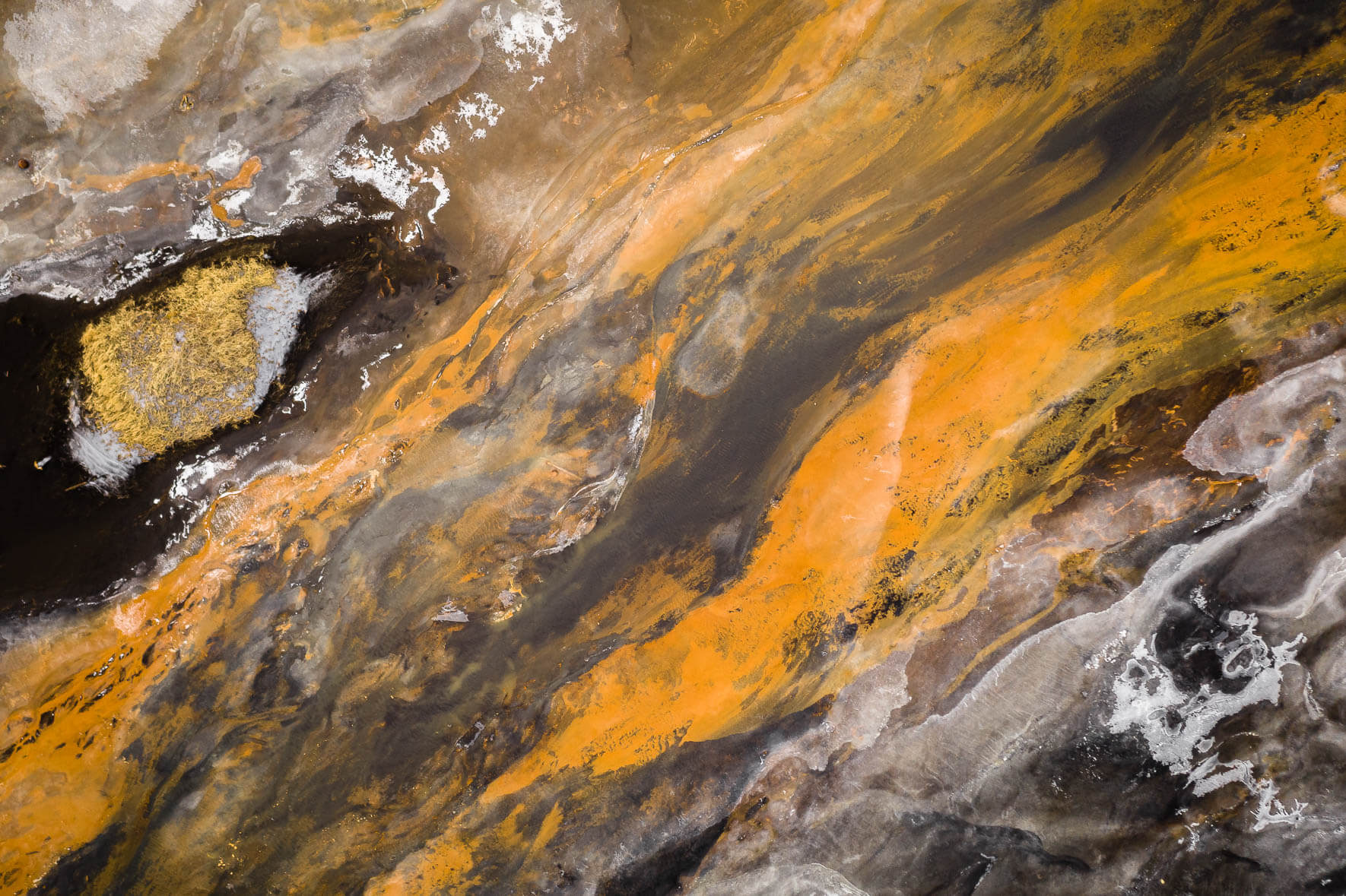 Aerial Landscape of Iceland with Orange River, Snow and Black Sand