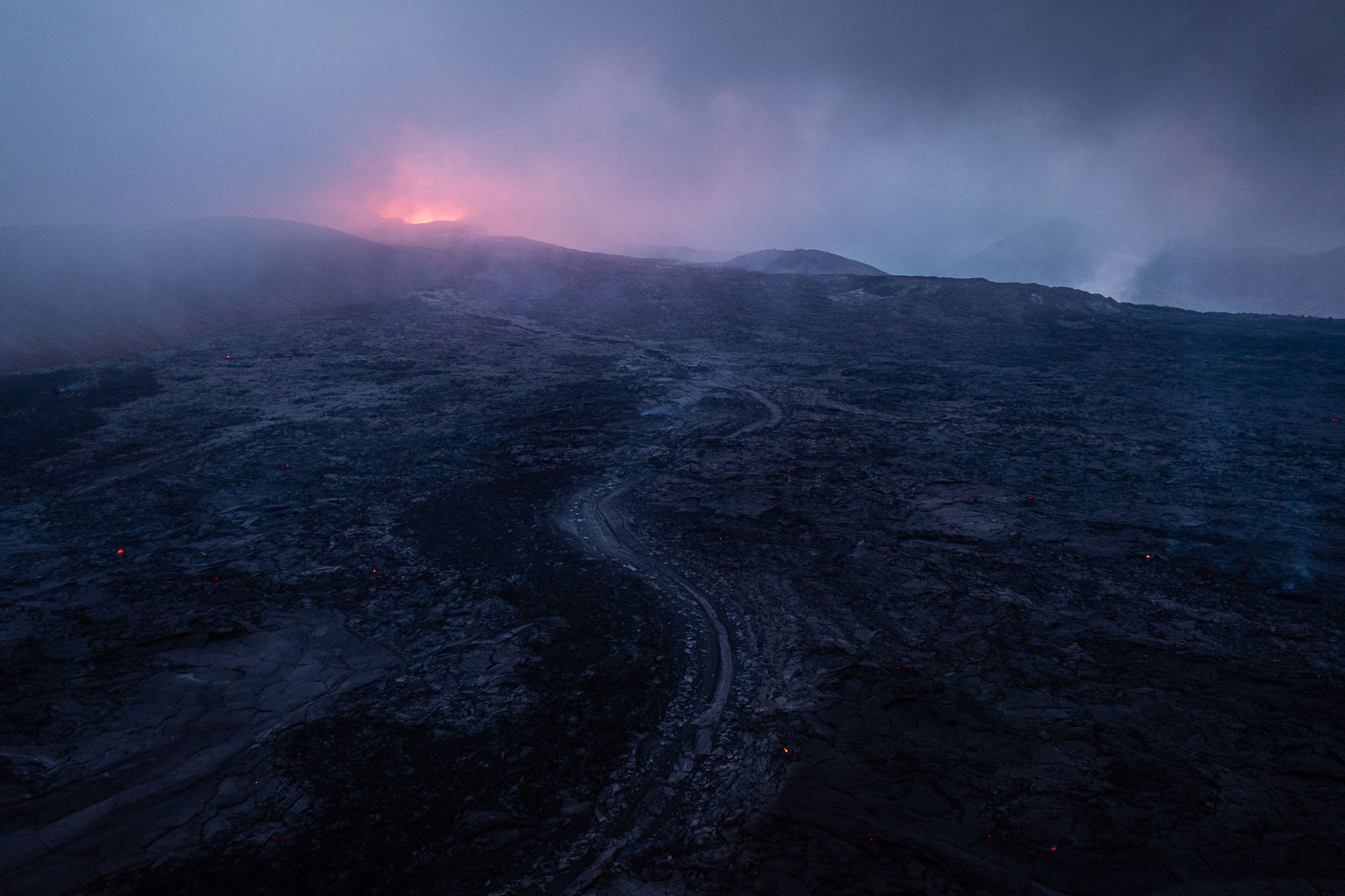 The crater of the eruption on Fagradalsfjall mountain (Iceland) in the fog during dusk