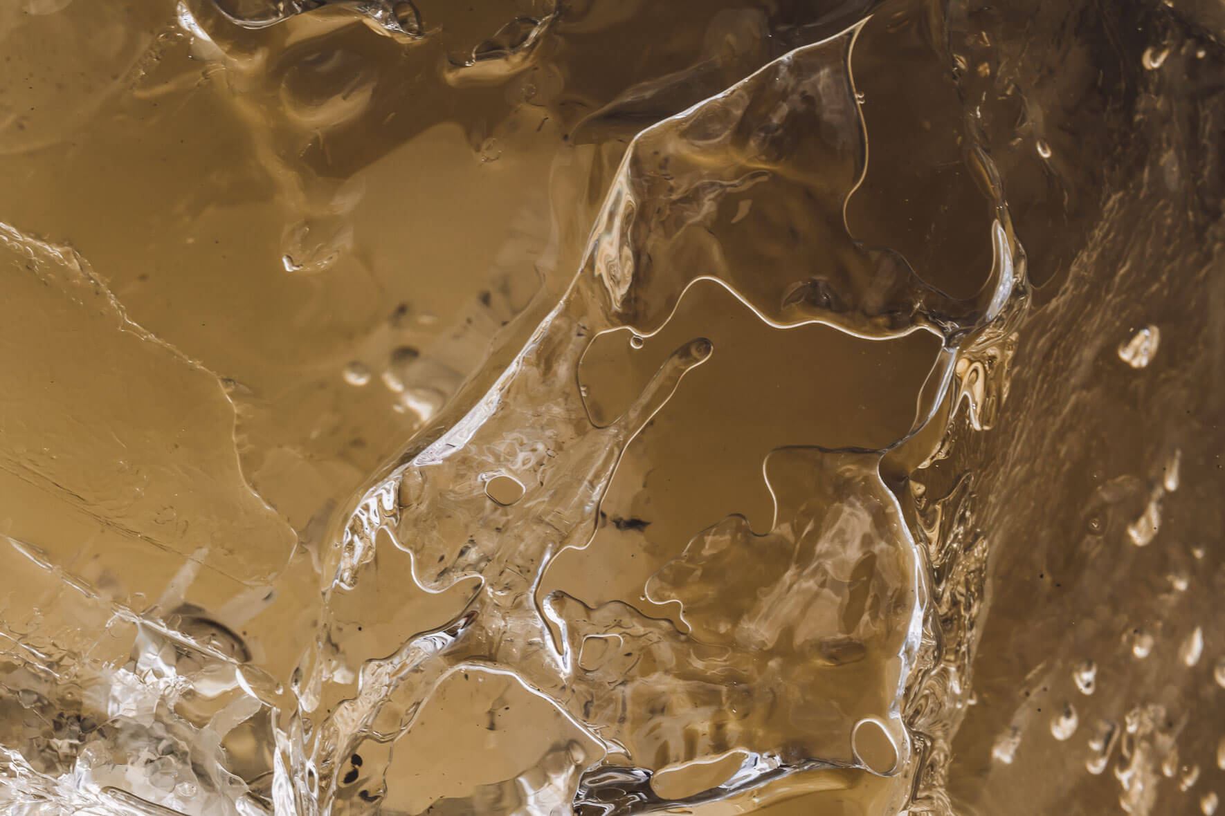 Macro view of glacial ice with air pockets and sediments