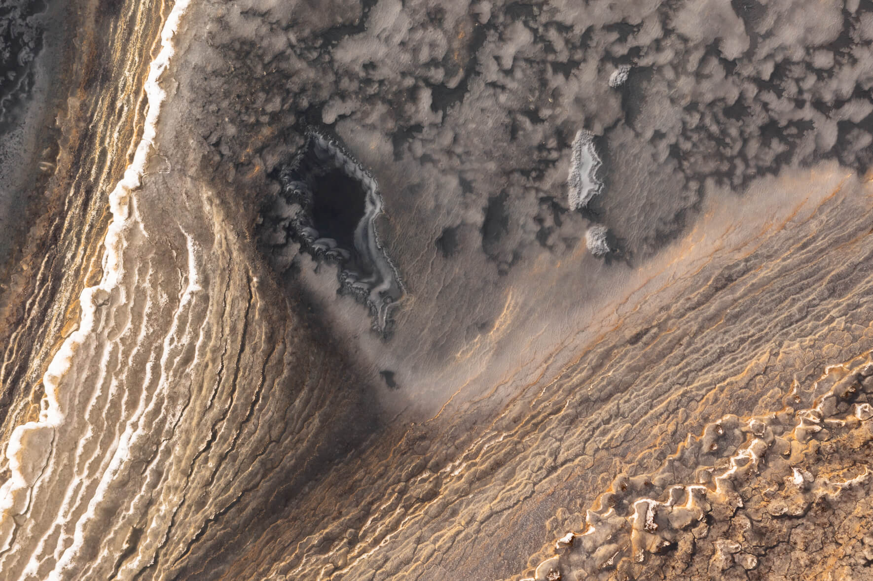 Abstract aerial photo of a frozen pond on Jökuldalsheiði plateau in eastern Iceland