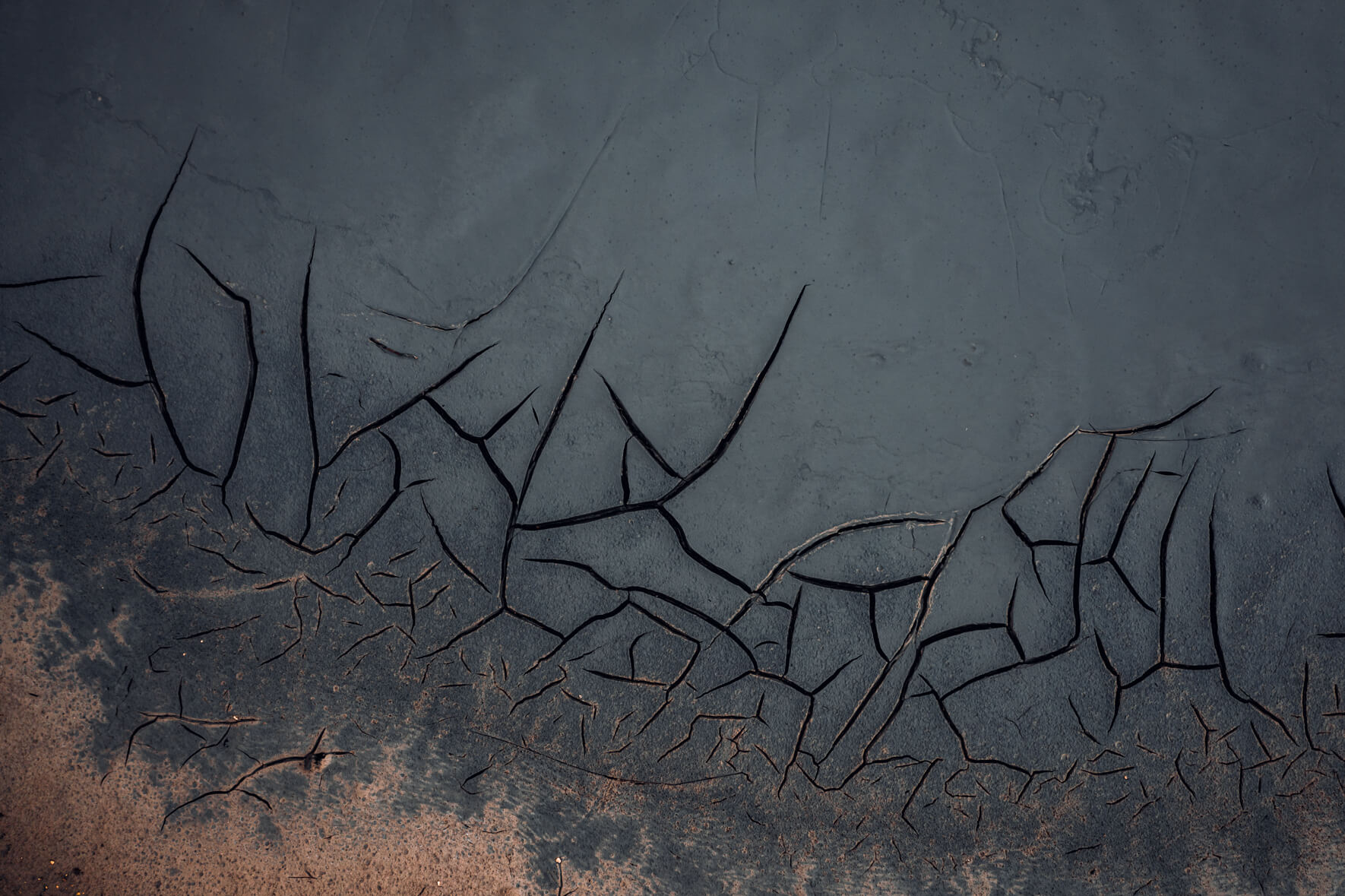 Cracked mud formations in the geothermal field of Námafjall, Iceland