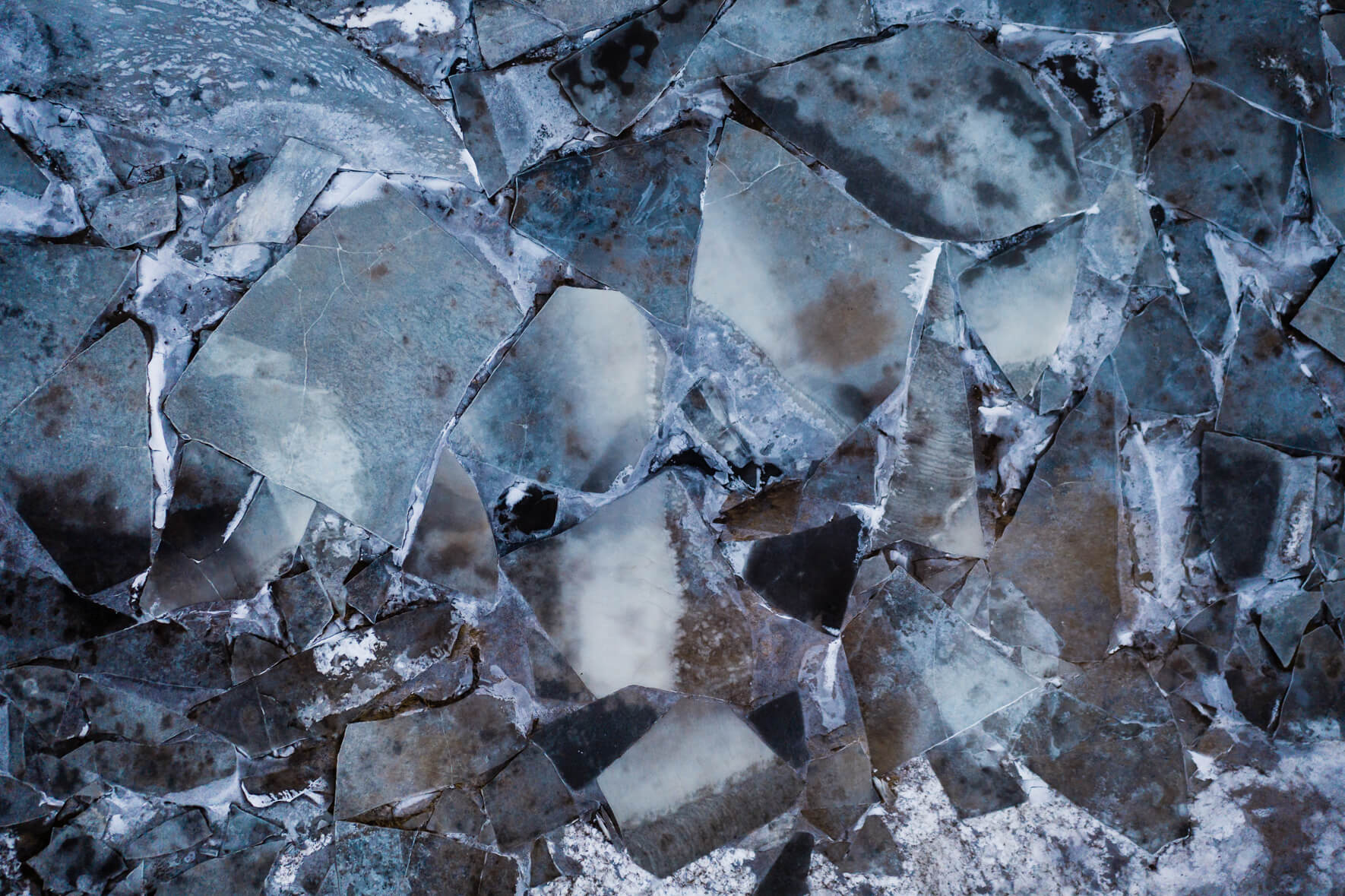 Colorful puzzle of ice floes on the frozen river Ölfusá in Iceland