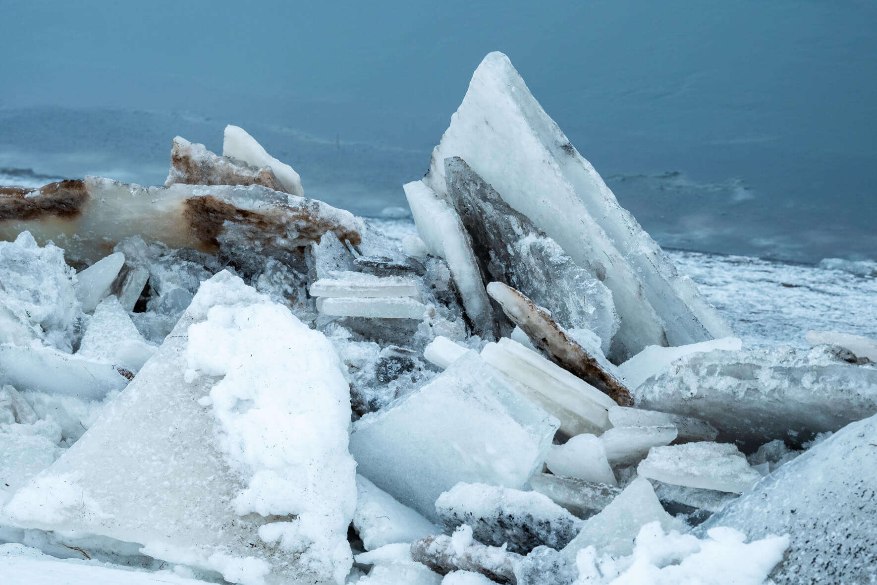Ice floes stacked on top of each other on the banks of a river on the south coast of Iceland