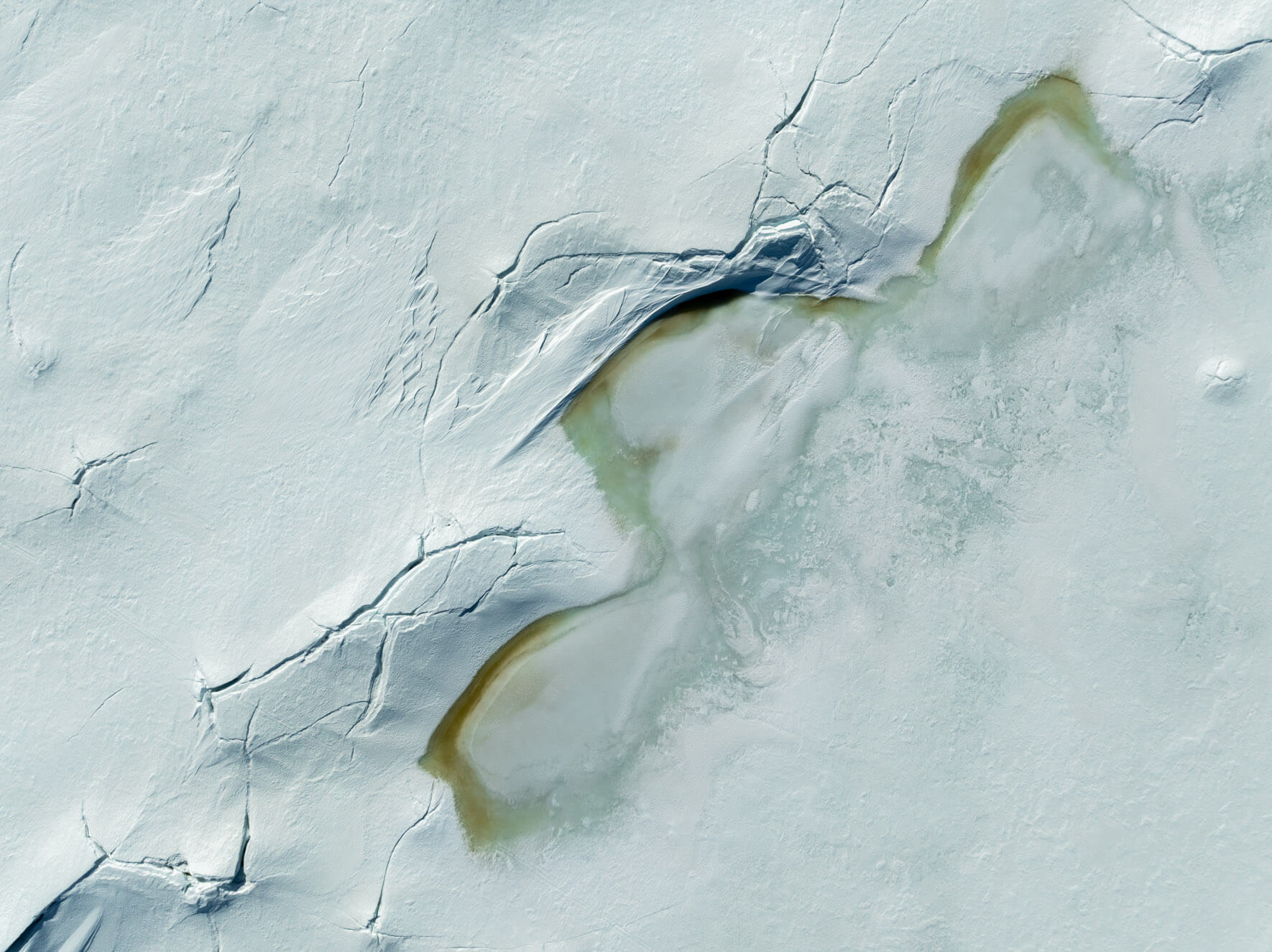 Cracks in the frozen lake surface of Hardangervidda Norway