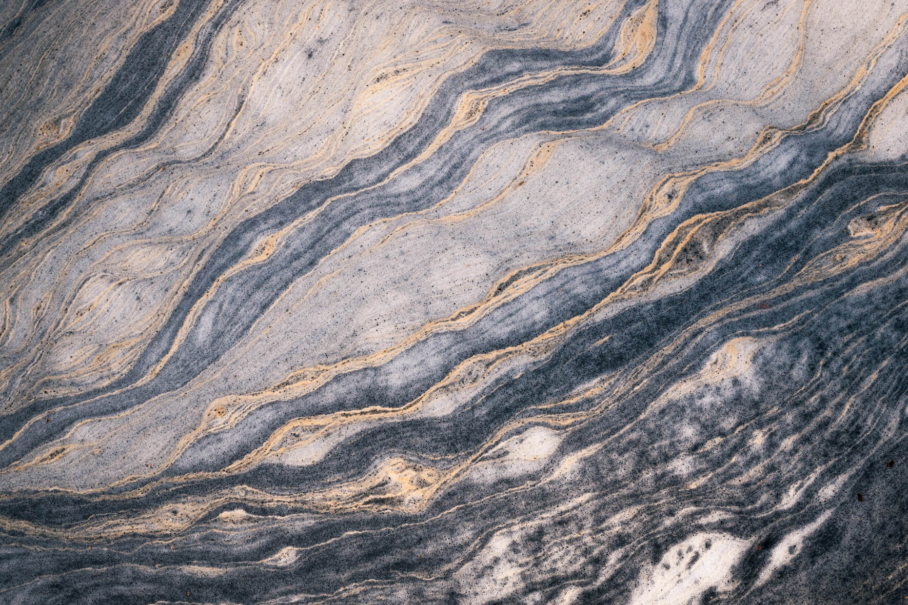 Close-up of swirling pollen formations on a small stream in southern Norway