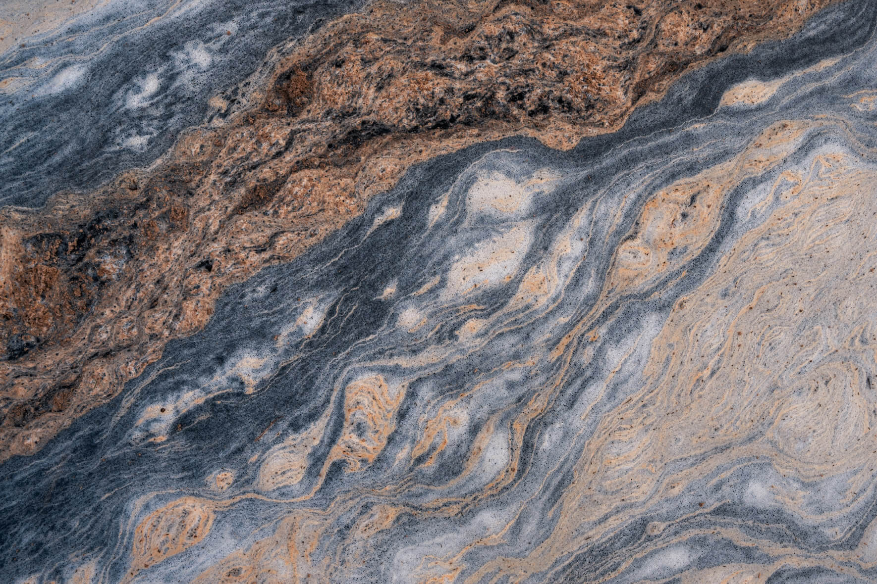 Close-up of swirling pollen formations on a small stream in southern Norway