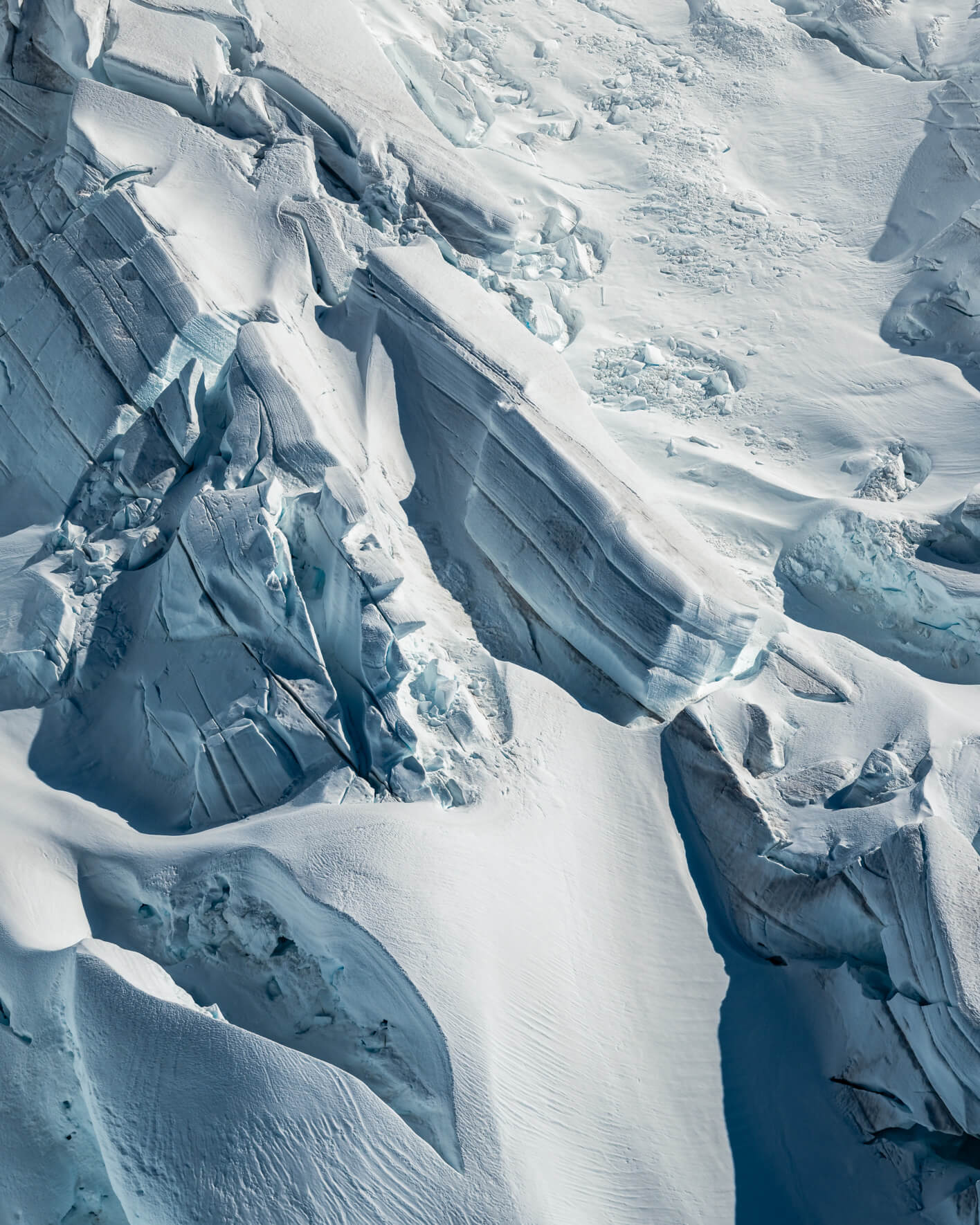 Aerial view of snow-covered glacier surface in Alaska