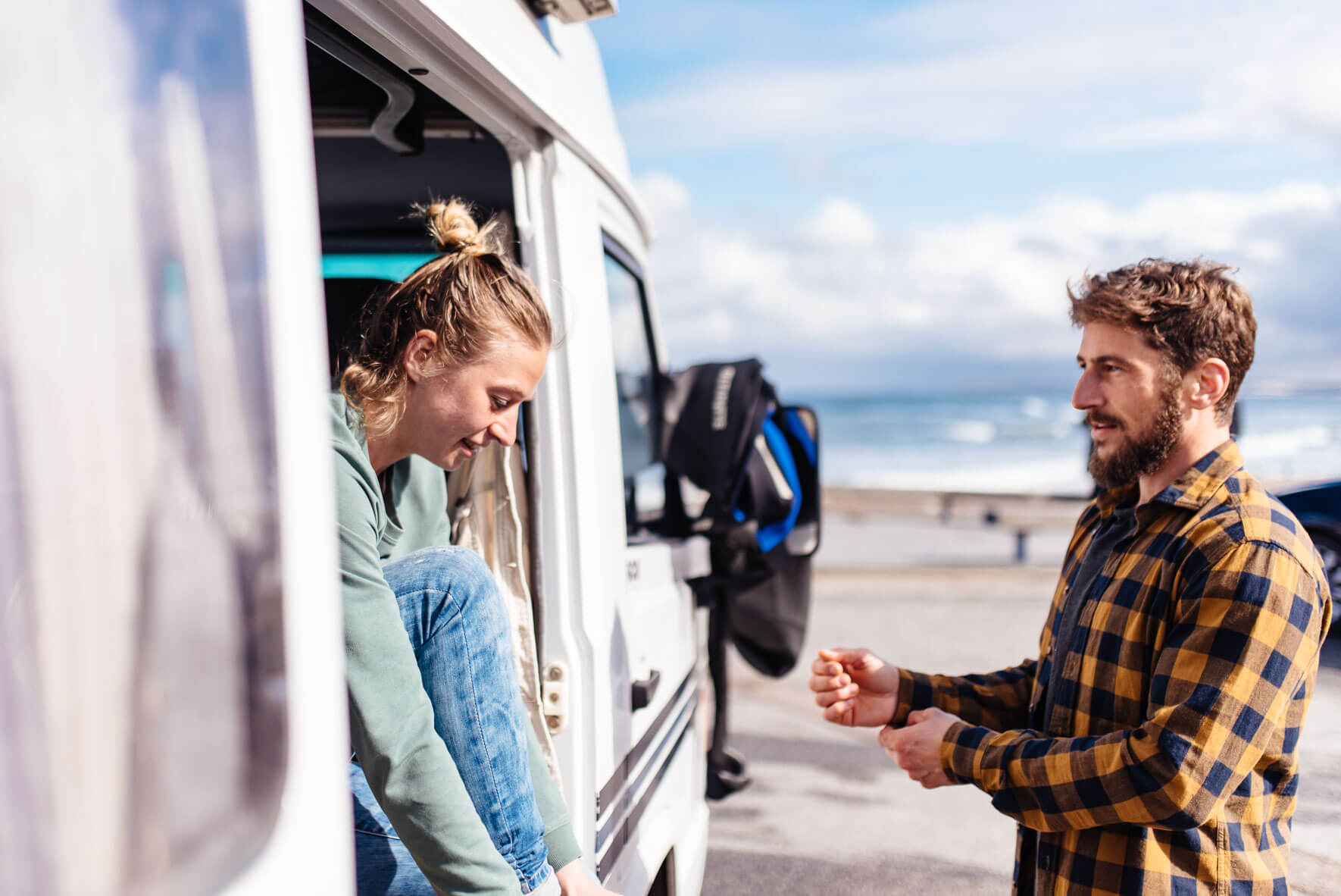 Two friends getting ready to surf in Klitmøller, Denmark