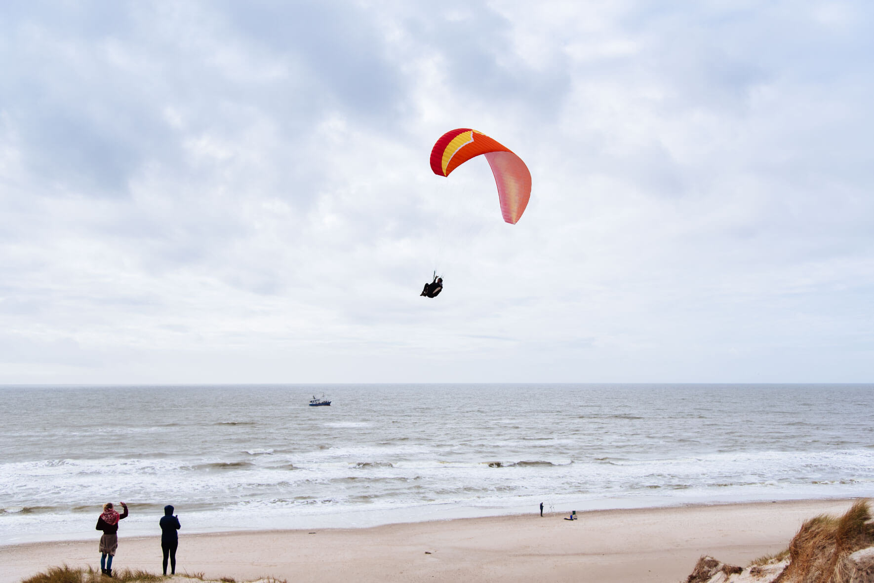 Dune paragliding on a beach in Denmark