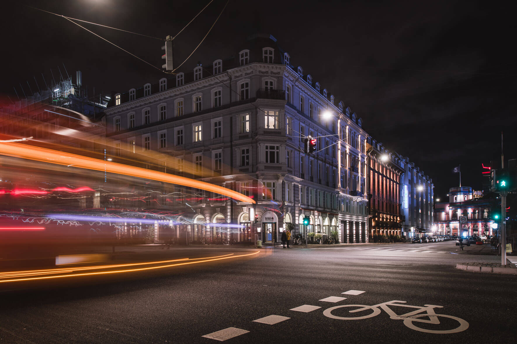Hotel Alexandra in Copenhagen, Denmark at night with traffic