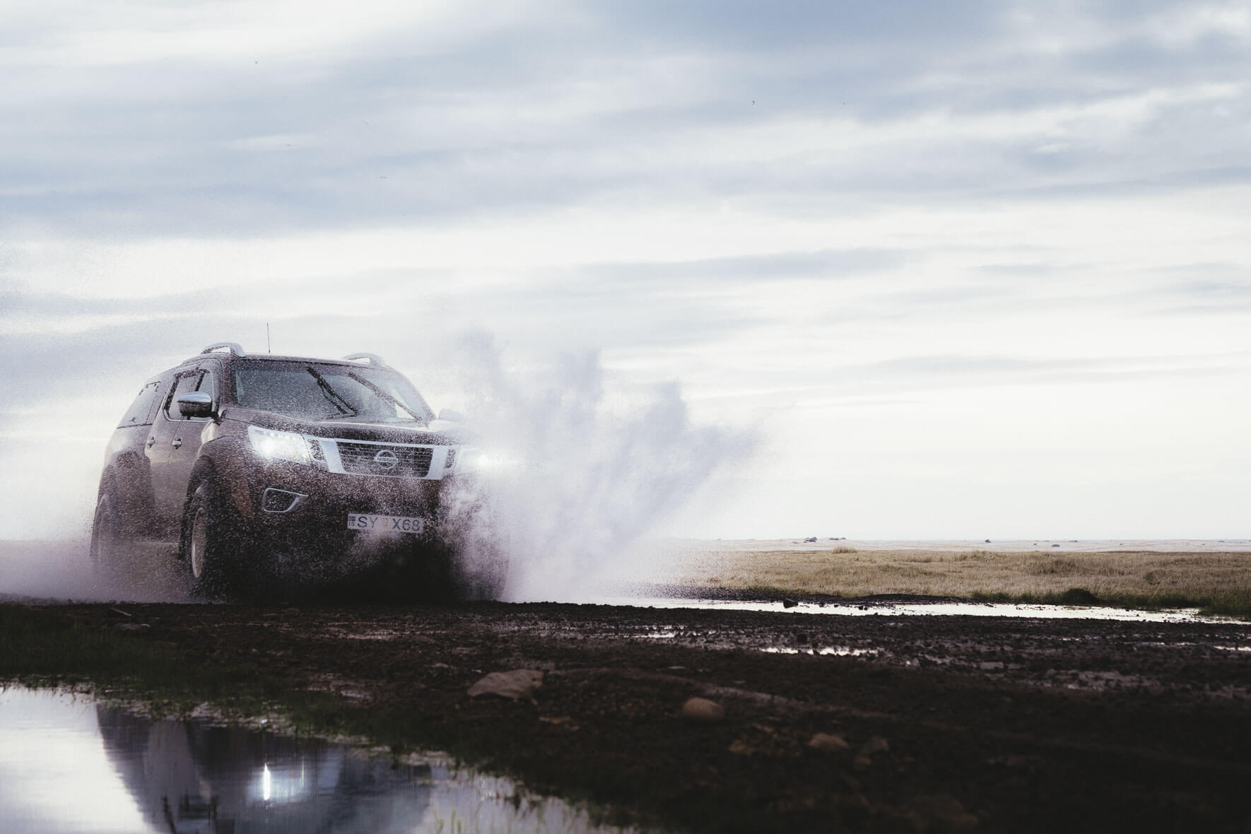 Nissan Navara AT35 (Arctic Trucks) on a muddy road in Iceland