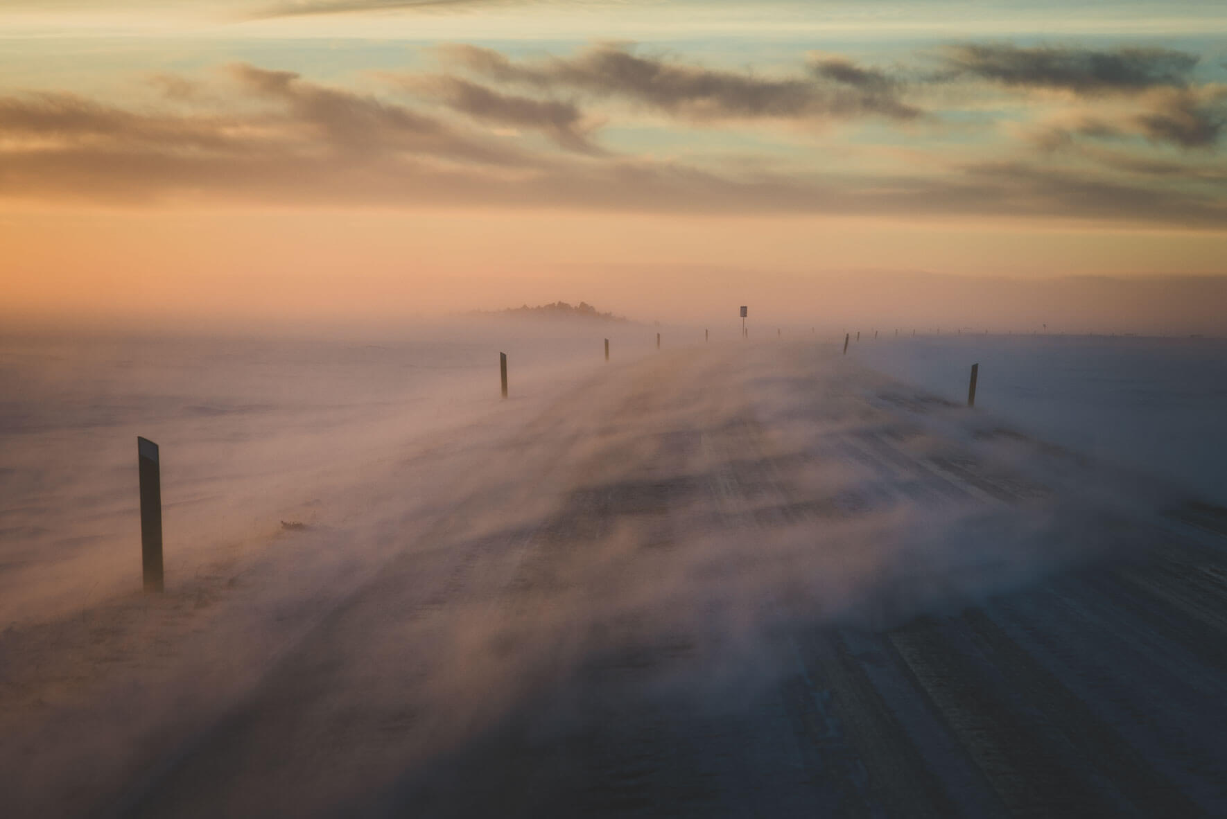 Snow blowing over road in Iceland