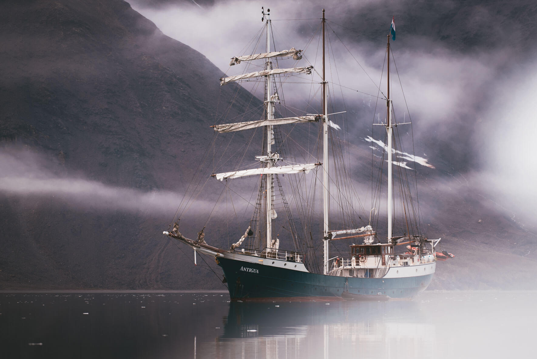 Three-mast sailing ship Antigua in the waters of Svalbard