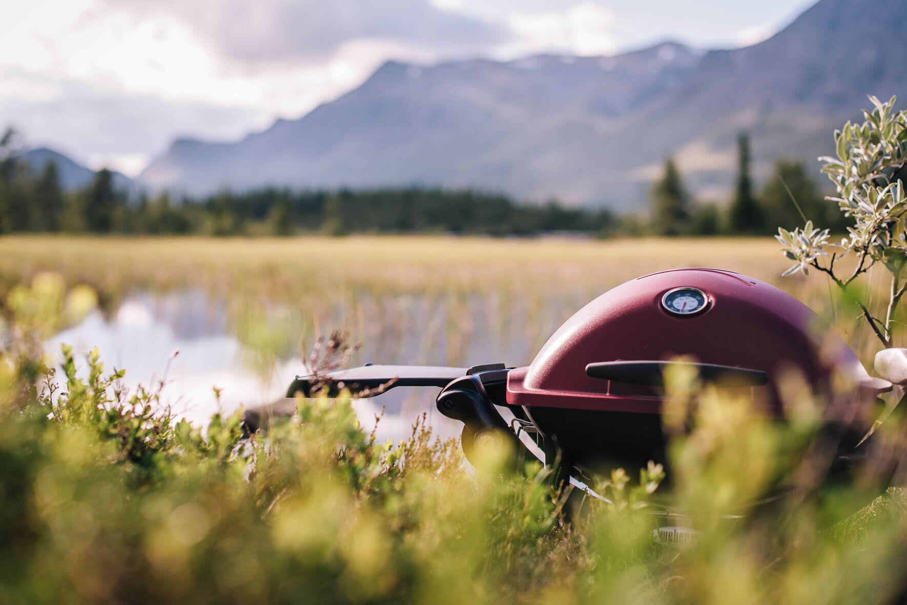 Weber Q1200 grill in Norway with nearby lake