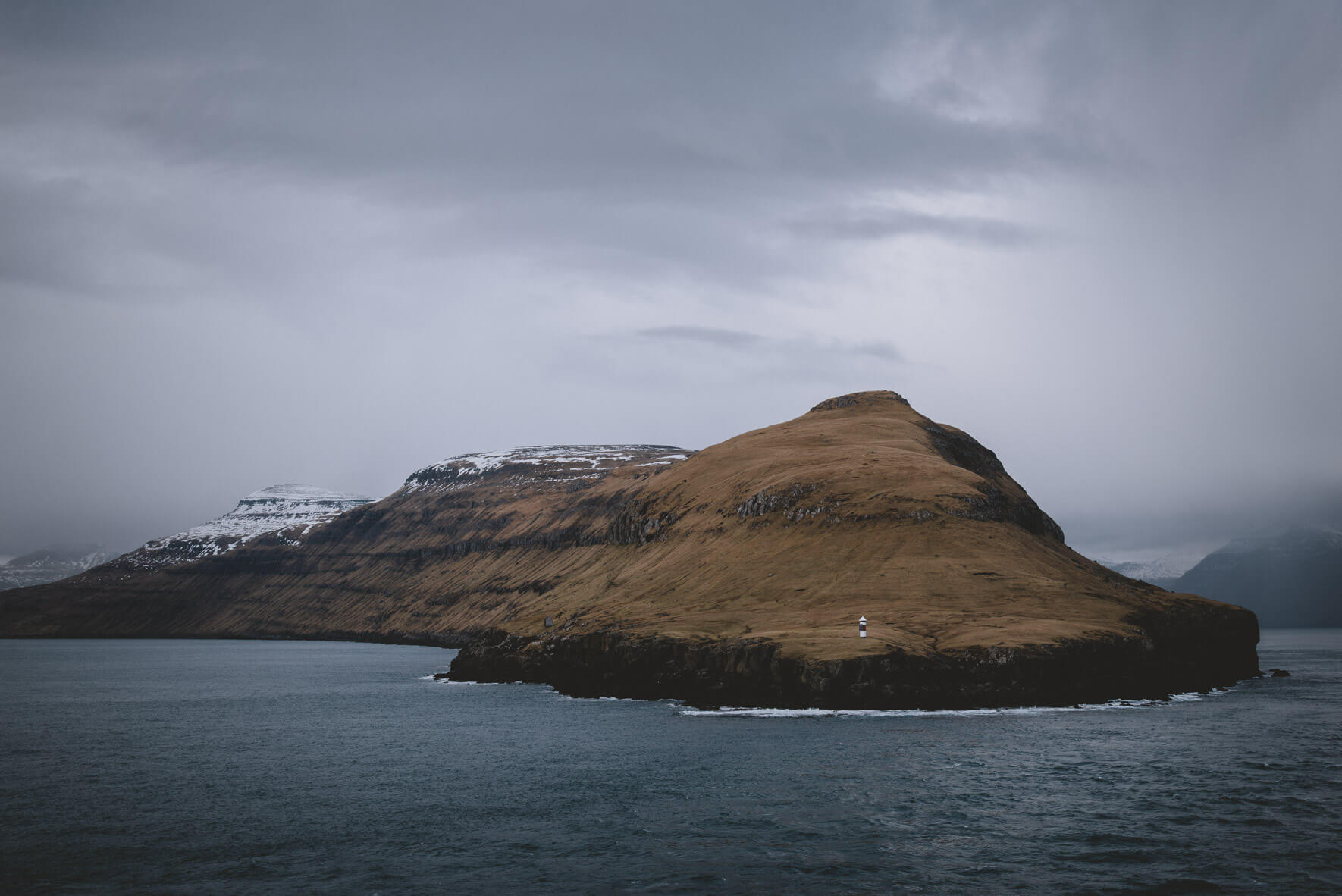 Small lighthouse on the coast of the Faroe Islands