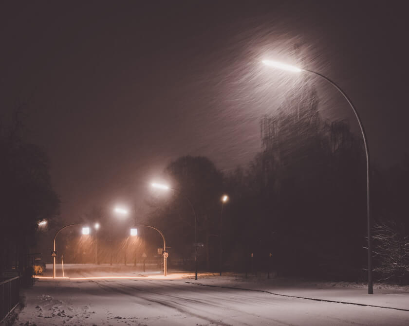 Snowy roads at night in Hamburg, Germany