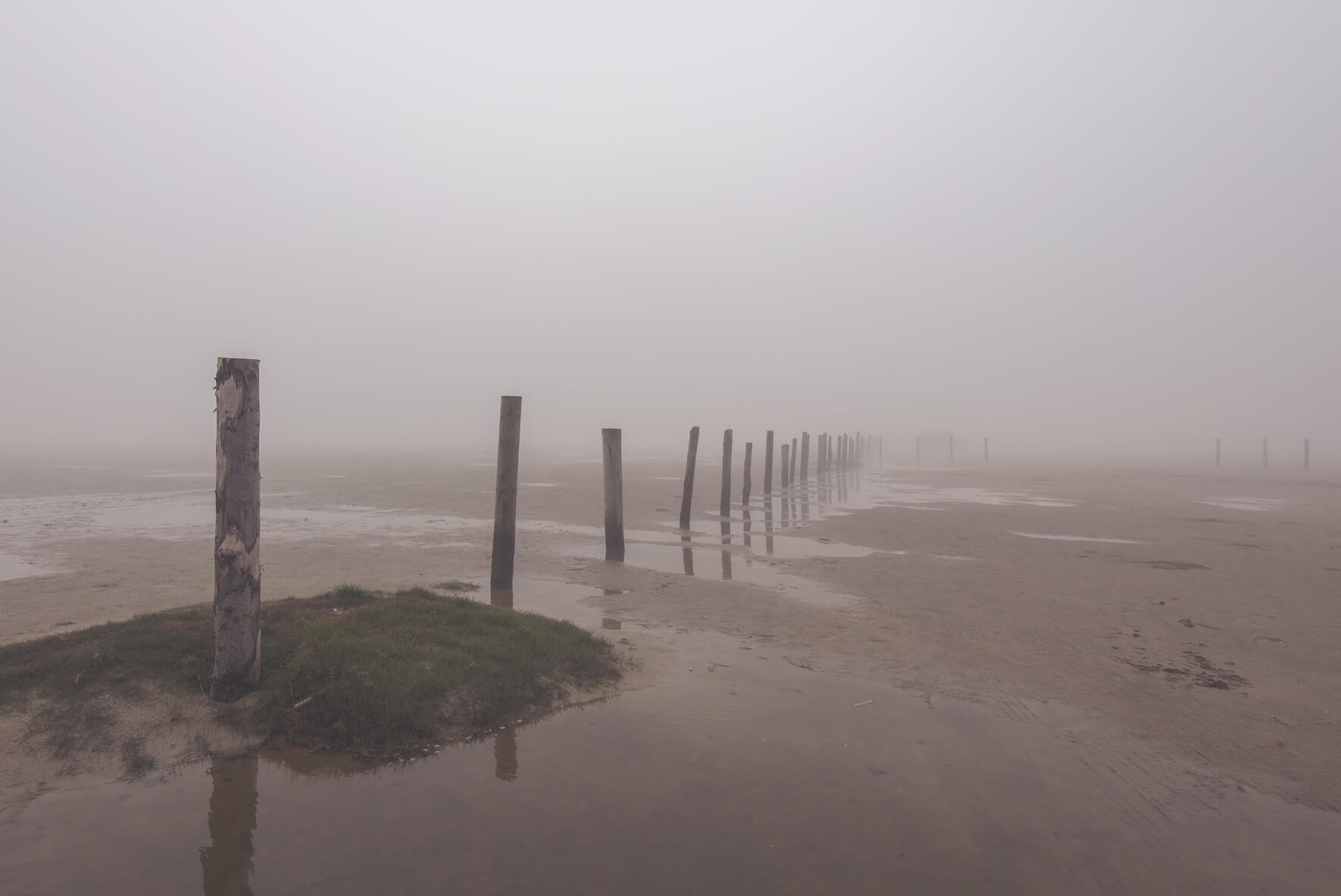 Foggy weather over the beach in St. Peter-Ording in Germany