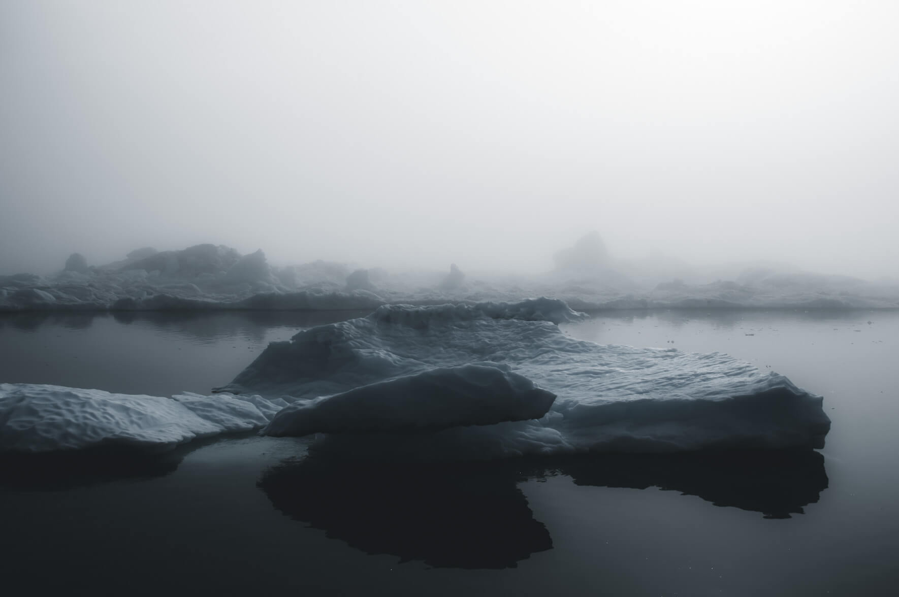 Arctic landscape with icebergs in the fog (Disko Bay, Greenland)