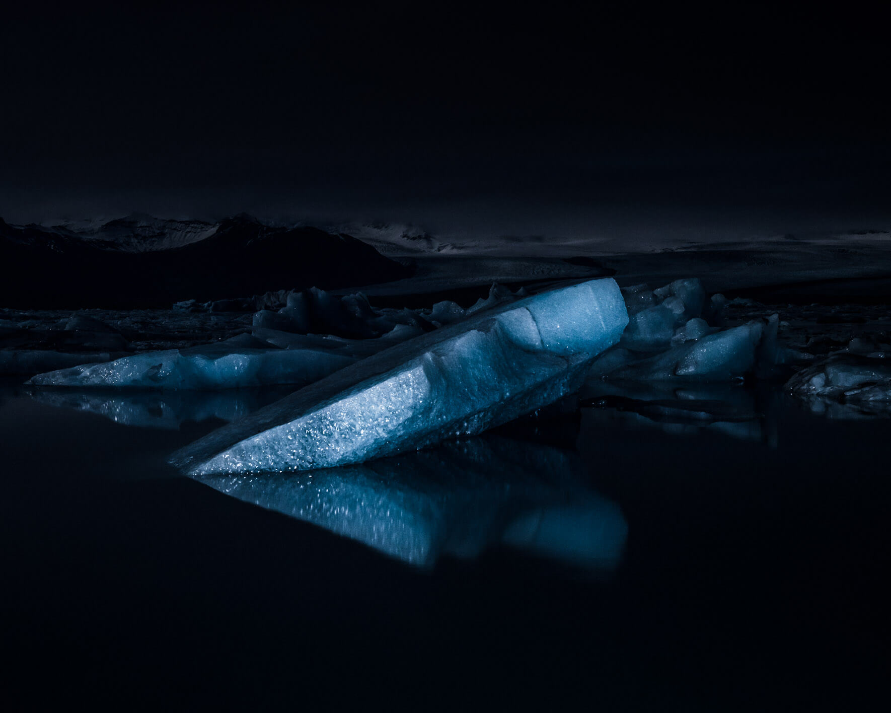 Icebergs of Jökulsárlón Glacier Lagoon illuminated with LED lights