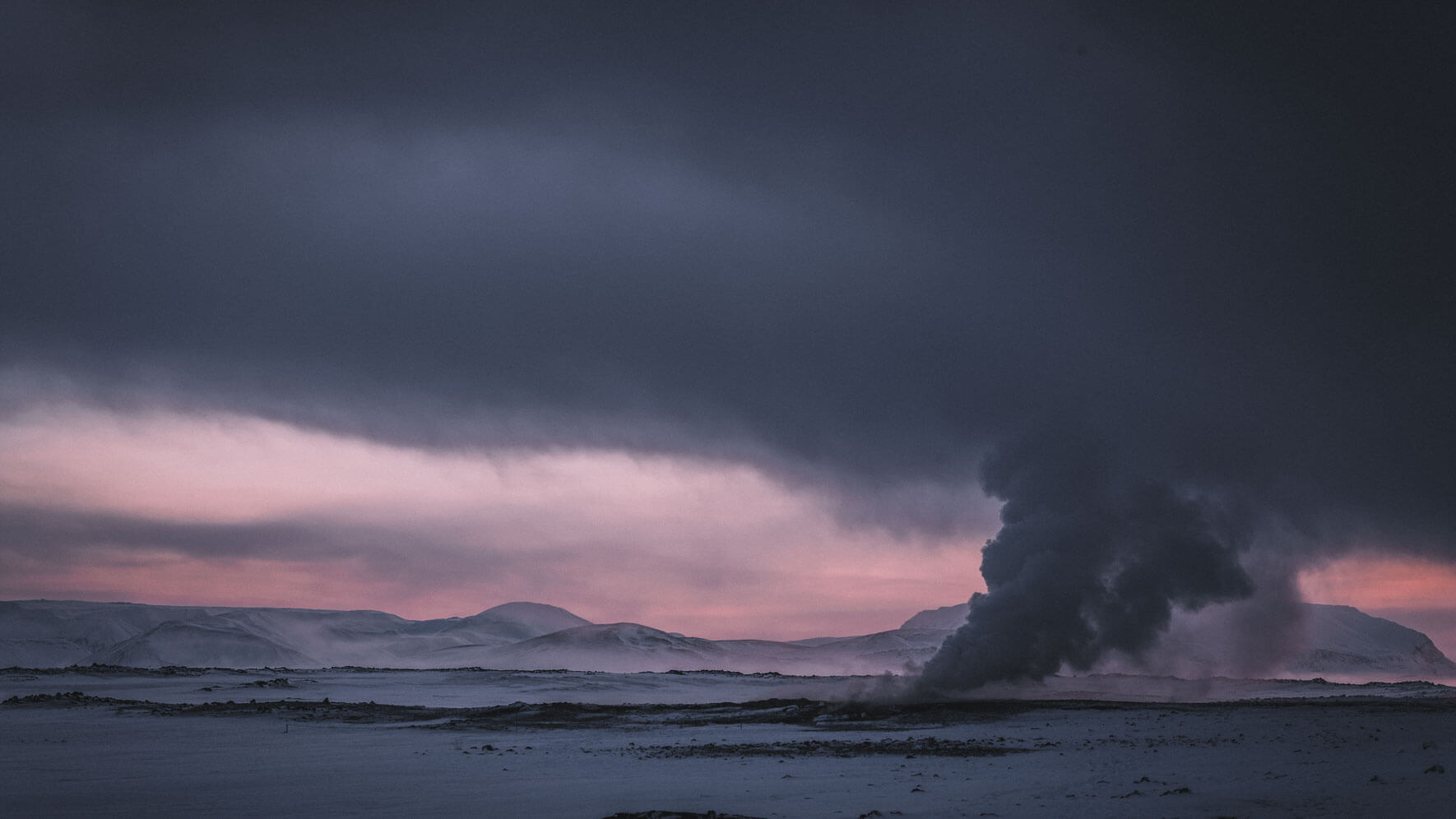 Steam clouds over geothermal area of Mt. Námafjall in Iceland