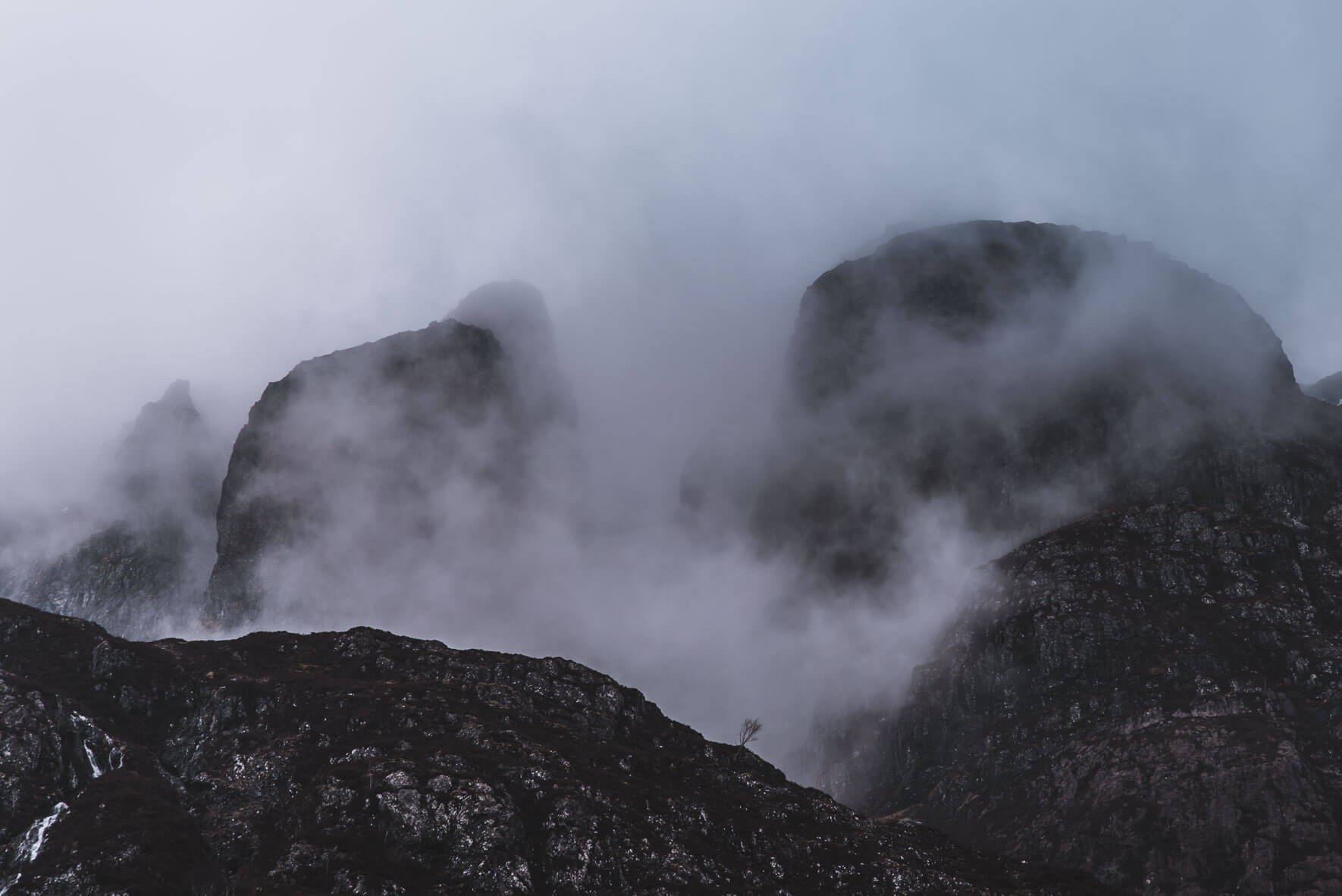 Foggy mountains of Glen Coe in the Highlands of Scotland
